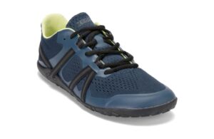 A dark blue athletic shoe with black accents and laces, featuring a breathable mesh upper, yellow inner lining, and a minimalist black sole, designed for ultimate comfort. Perfect for digital nomads seeking the freedom of lightweight barefoot shoes wherever they roam.