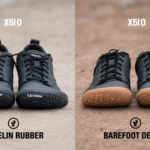 Two pairs of black Xero Shoes rest on sandy ground. The left pair features durable soles with Michelin rubber and Xero logos, while the right pair has a plain sole. Text above each reads "X5|0.