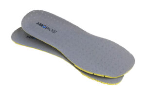 A pair of gray Xero Shoes Insoles with yellow edges, designed for comfort and durability, featuring the Xero Shoes logo in black and blue text, stacked on top of each other on a white background.