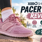 A person walks outdoors in dusty rose Xero Pacer Lite sneakers, featuring a wide toe box and zero-drop design for natural walking comfort.
