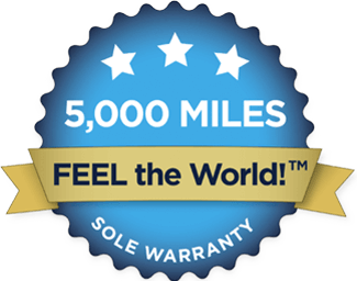 Blue and gold warranty badge stating "5,000 miles sole warranty feel the world™" with three stars at the top for barefoot shoes.